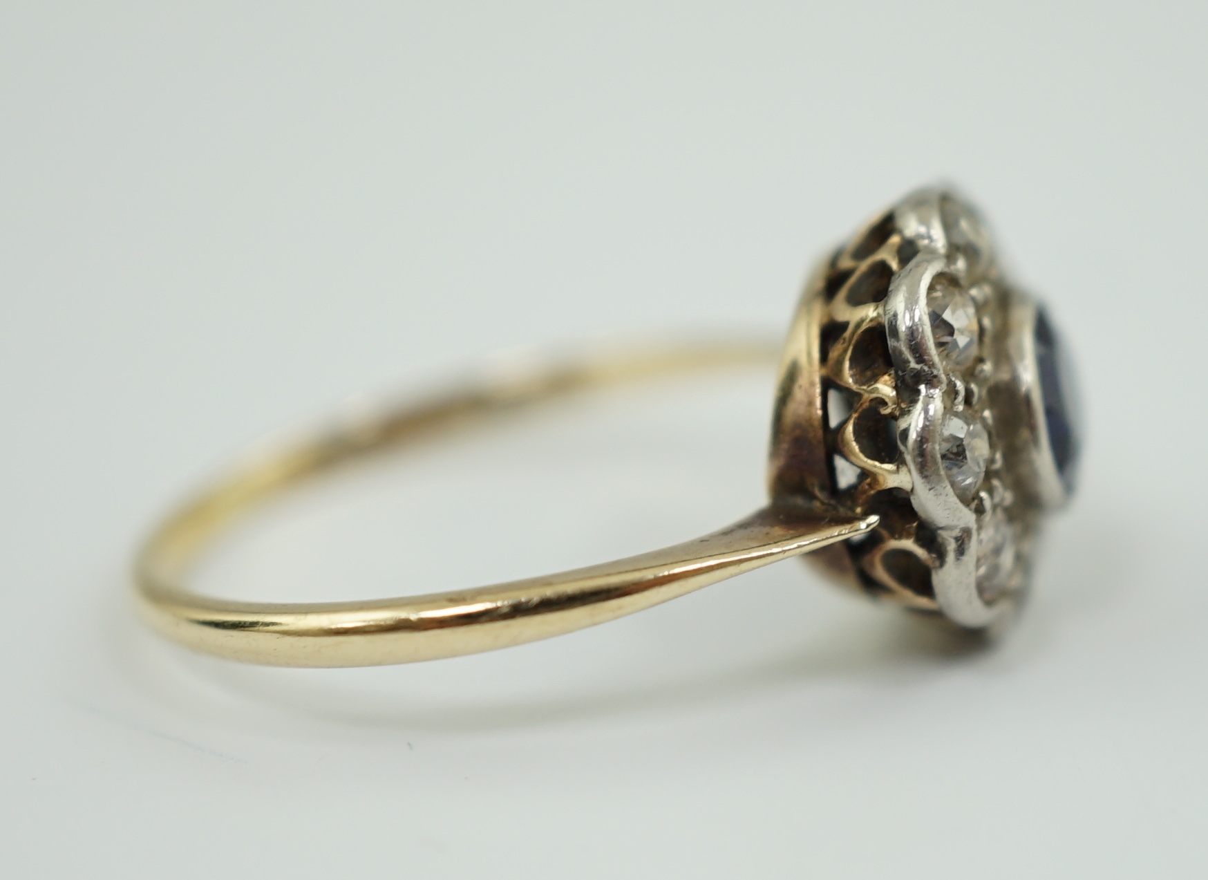 A 1920's 18ct gold, sapphire and diamond set flower head cluster ring